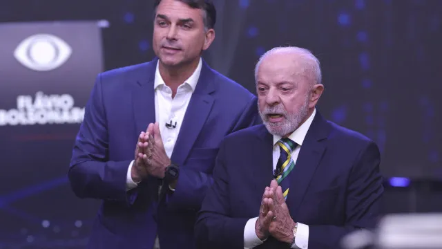 Num Brasil dividido, Lula e Bolsonaro vão a votos: O que promete cada um?