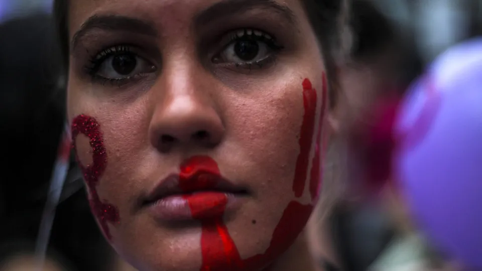 Women participate at a protest against feminicide