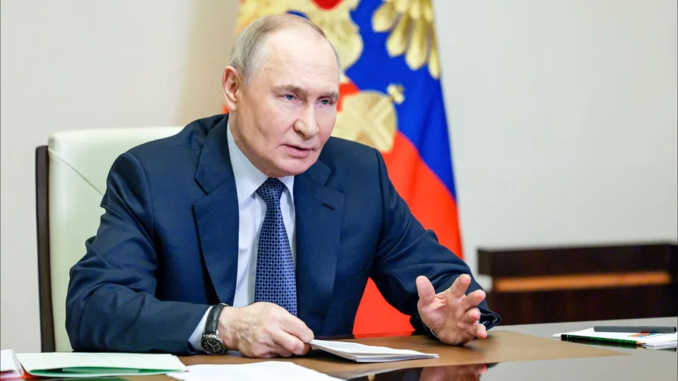 Russian President Vladimir Putin chairs a meeting with members of the Security Council