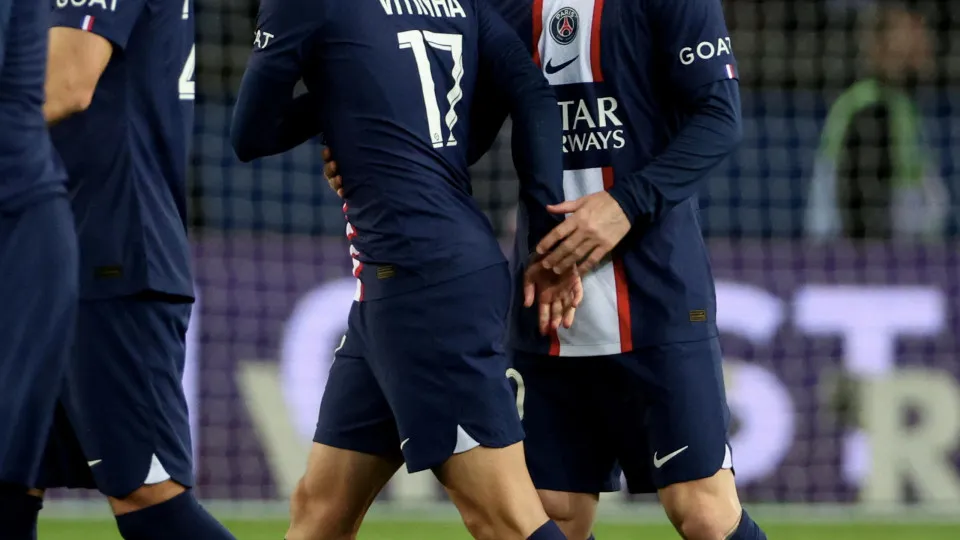 PARIS, FRANCE - APRIL 15: Vitinha of Paris Saint-Germain celebrates after scoring the team's second goal with teammate Lionel Messi during the Ligue 1 match between Paris Saint-Germain and RC Lens at Parc des Princes on April 15, 2023 in Paris, France. (P