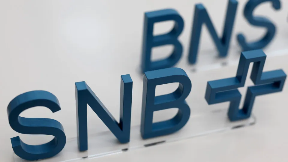 A Swiss National Bank (SNB) logo in Zurich, Switzerland, on Thursday, June 20, 2024. The Swiss National Bank cut borrowing costs again to loosen constriction on the economy and stem gains in the franc, a move that contrasts with the hesitancy of global pe