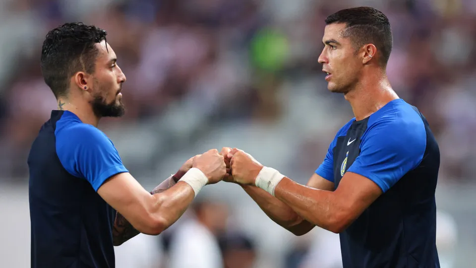 OSAKA, JAPAN - JULY 27: Alex Telles and Cristiano Ronaldo of Al-Nassr warms up during the pre-season friendly match between FC Internazionale and Al-Nassr at Yanmar Stadium Nagai on July 27, 2023 in Osaka, Japan. (Photo by Robbie Jay Barratt - AMA/Getty I