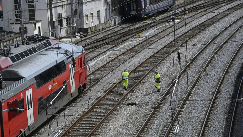 LISBON, PORTUGAL - MAY 07: Maintenance workers walk along the railway yard off Santa Apolonia train station on a first of a seven days national strike by railway workers that, according to CP Comboios de Portugal is causing major disruptions, on May 07, 2