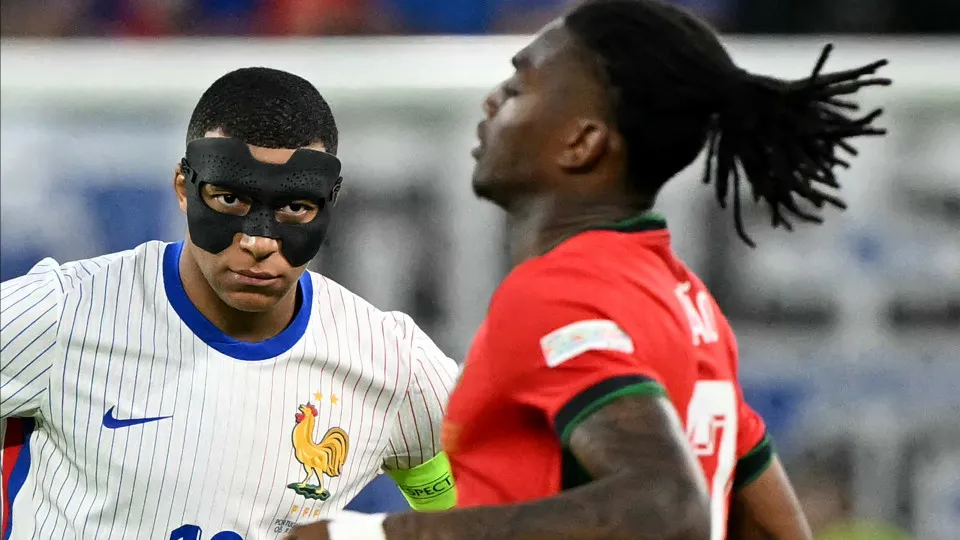 France's forward #10 Kylian Mbappe watches Portugal's forward #17 Rafael Leao at the start of the second half-time during the UEFA Euro 2024 quarter-final football match between Portugal and France at the Volksparkstadion in Hamburg on July 5, 2024. (Phot