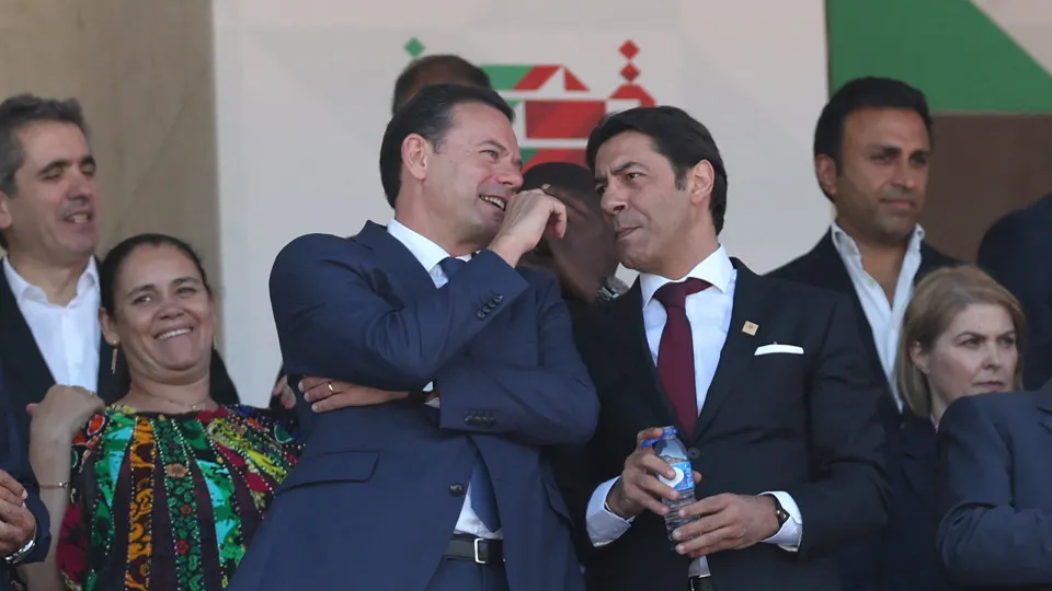 Portuguese Prime Minister Luis Montenegro and President of SL Benfica Rui Manuel Cesar Costa speak prior to the 'Taca de Portugal' (Portugal's Cup) final football match between SL Benfica and Sporting CP at Jamor stadium in Oeiras, on May 25, 2025. (Photo
