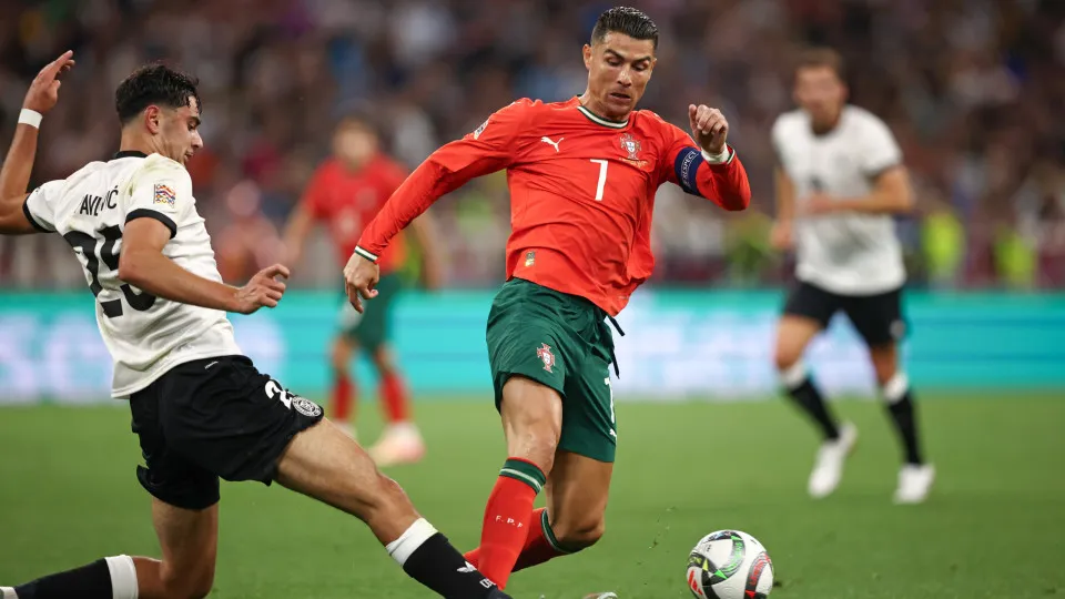 MUNICH, GERMANY - JUNE 04: Cristiano Ronaldo of Portugal vies with Aleksandar Pavlovic of Germany  during the UEFA Nations League 2025 semifinal match between Germany and Portugal at Munich Football Arena on June 04, 2025 in Munich, Germany. (Photo by Ste