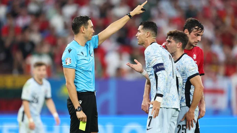 GELSENKIRCHEN, GERMANY - JUNE 26: Cristiano Ronaldo of Portugal reacts after being shown a yellow card by Referee Sandro Scharer during the UEFA EURO 2024 group stage match between Georgia and Portugal at Arena AufSchalke on June 26, 2024 in Gelsenkirchen