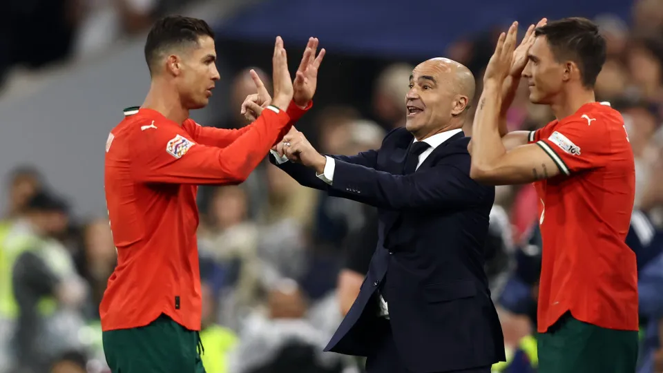 MUNICH, GERMANY - JUNE 04: Roberto Martinez Head Coach of Portugal with Cristiano Ronaldo of Portugal and Joao Palhinha of Portugal during the UEFA Nations League 2025 semifinal match between Germany and Portugal at Munich Football Arena on June 04, 2025 