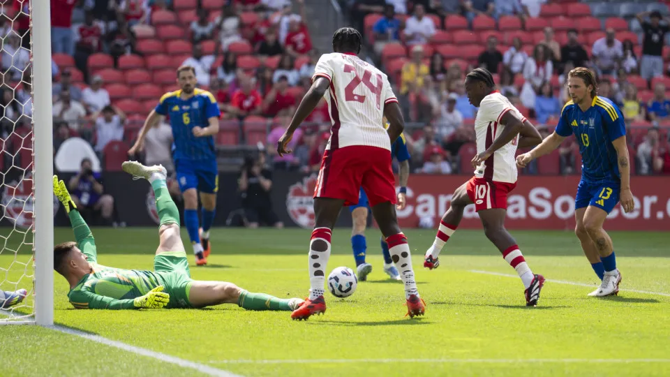 TORONTO, ON - JUNE 7: Jonathan David #10 of Canada scores on Anatoliy Trubin #12 of Ukraine during the first half of their Canadian Shield Tournament match at the BMO Field on June 7, 2025 in Toronto, Ontario, Canada.   (Photo by Mark Blinch/Getty Images)