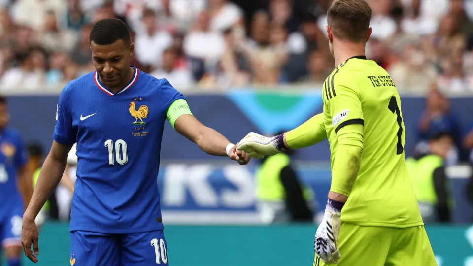 's forward #10 Kylian Mbappe (L) interacts with 's goalkeeper #01 Marc-Andre Ter Stegen during the UEFA Nations League third place play-off football match between  and  in Stuttgart, southwestern  on June 8, 2025. (Photo b