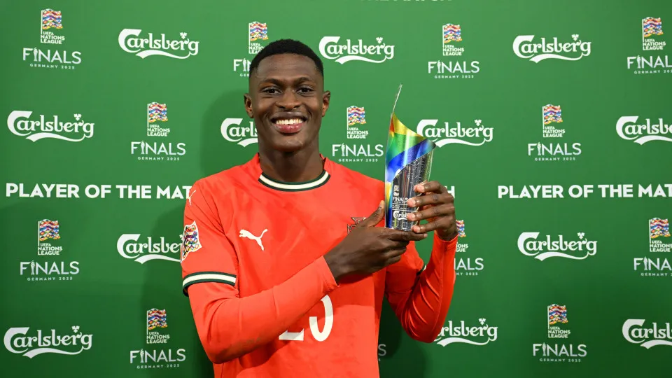 MUNICH, GERMANY - JUNE 08: Nuno Mendes of Portugal poses for a photo with his Carlsberg player of the match award following the UEFA Nations League 2025 final match between Portugal and Spain at Munich Football Arena on June 08, 2025 in Munich, Germany. (