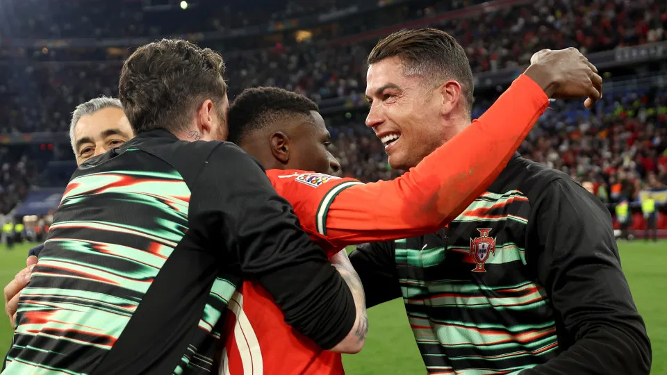MUNICH,  - JUNE 08: Cristiano Ronaldo and Nuno Mendes of Portugal celebrate victory following the UEFA Nations League 2025 final match between Portugal and Spain at Munich Football Arena on June 08, 2025 in Munich, . (Photo by Maja Hitij - U