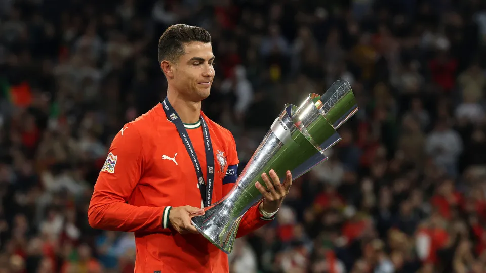 MUNICH, GERMANY - JUNE 08: Cristiano Ronaldo of Portugal holds the UEFA Nations League trophy after his team's victory in during the UEFA Nations League 2025 final match between Portugal and Spain at Munich Football Arena on June 08, 2025 in Munich, Germa