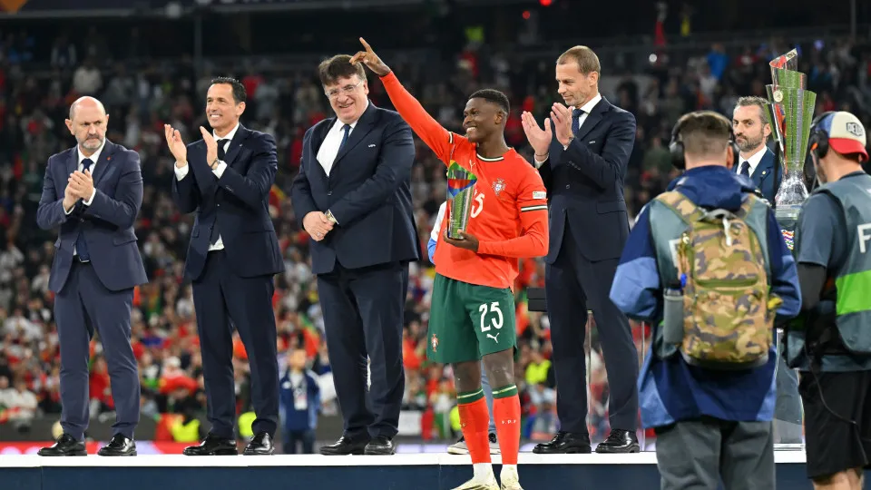 MUNICH, GERMANY - JUNE 08: Nuno Mendes of Portugal celebrates with his player of the finals award following victory in the UEFA Nations League 2025 final match between Portugal and Spain at Munich Football Arena on June 08, 2025 in Munich, Germany. (Photo