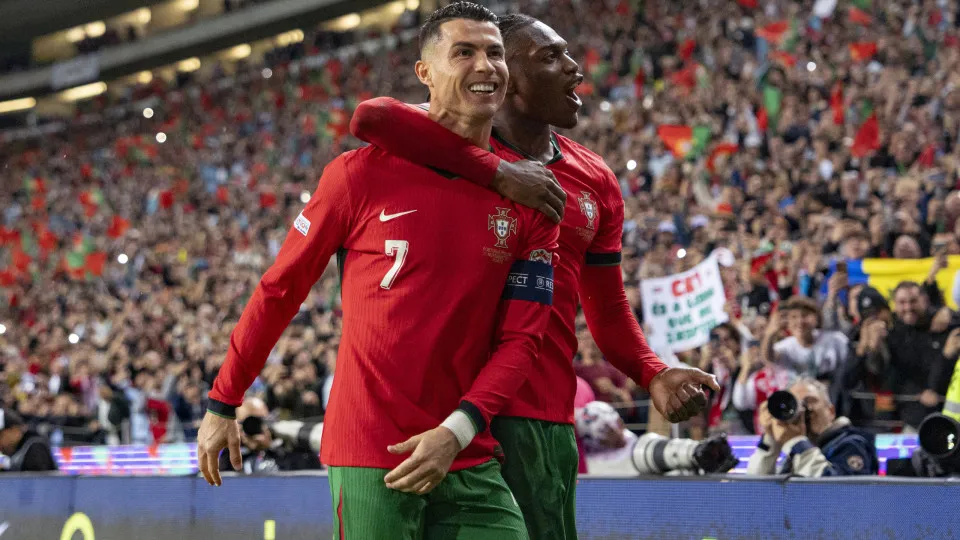 PORTO, PORTUGAL - NOVEMBER 15: Cristiano Ronaldo of Portugal (L) celebrates his goal with teammate Rafael Leão (R) during the UEFA Nations League 2024/25 League A Group A1 match between Portugal and Poland at Estadio do Dragao on November 15, 2024 in Port