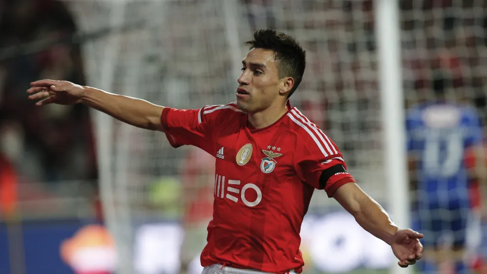 Benfica's midfielder Nicolas Gaitan celebrates the goal scored by Benfica's forward Eduardo Salvio during the Portuguese League football match between SL Benfica and CF Belenenses at Luz Stadium in Lisbon on December 6, 2014. NURPHOTO/CARLOS PALMA. (Photo