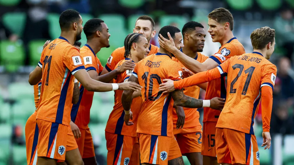 Netherland's forward #10 Memphis Depay (C) celebrates with teammates after scoring a goal during the FIFA World Cup 2026 Group G European qualification football match between the Netherlands and Malta at the Euroborg Stadium in Groningen on June 10, 2025.