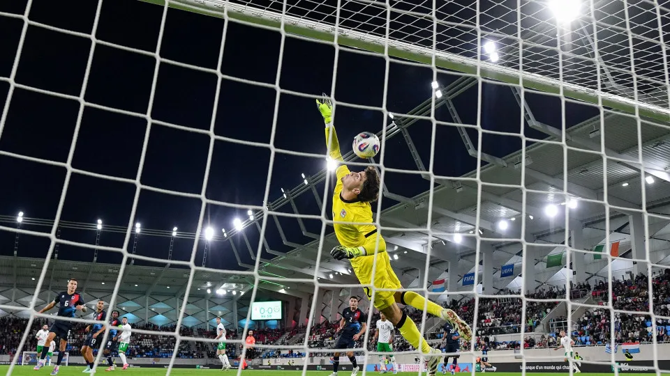 Luxembourg , Luxembourg - 10 June 2025; Luxembourg goalkeeper Tiago Pereira attempts to save the shot on goal of Jack Taylor of Republic of Ireland, which subsequently hit the crossbar, during the international friendly match between Luxembourg and Republ