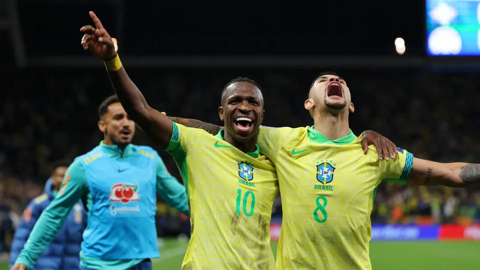 SAO PAULO, BRAZIL - JUNE 10: Vinicius Junior of Brazil celebrates with Bruno Guimaraes of Brazil after scoring the team's first goal during the FIFA World Cup 2026 South American Qualifier between Brazil and Paraguay at Neo Quimica Arena on June 10, 2025 