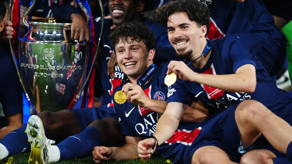 Paris Saint-Germain's Joao Neves and Vitinha with the trophy after winning the UEFA Champions League final at the Munich Football Arena, Munich, Germany. Picture date: Saturday May 31, 2025. (Photo by Mike Egerton/PA Images via Getty Images)