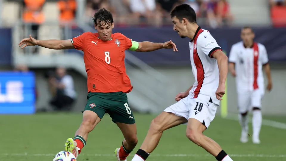 TRENCIN, SLOVAKIA - JUNE 17: Paulo Bernardo of Portugal competes for the ball with Giorgi Maisuradze of Georgia  during the UEFA European Under-21 Championship 2025 Group Stage match between Georgia and Portugal at Sihot Stadium on June 17, 2025 in Trenci