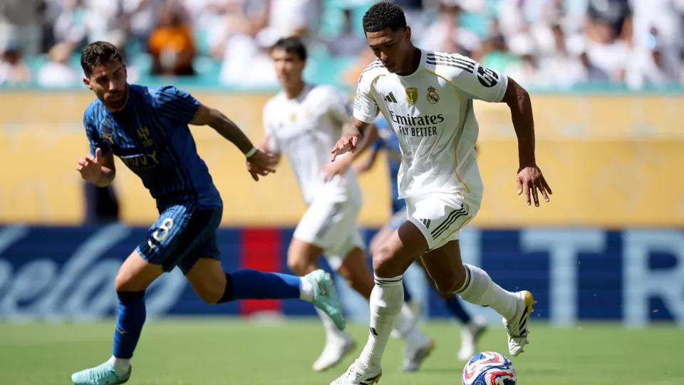 MIAMI GARDENS, FLORIDA - JUNE 18: Jude Bellingham #5 of Real Madrid C. F. is put under pressure by Ruben Neves #8 of Al Hilal during the FIFA Club World Cup 2025 group H match between Real Madrid CF and Al Hilal at Hard Rock Stadium on June 18, 2025 in Mi