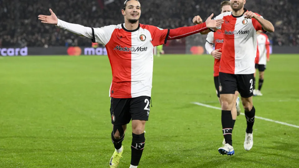 Feyenoord's Algerian forward #23 Anis Hadj-Moussa (L) celebrates with teammates after scoring his team's third goal during the UEFA Champions League, league phase football match between Feyenoord and Sparta Praha at the Stadion Feijenoord 'De Kuip' in Rot