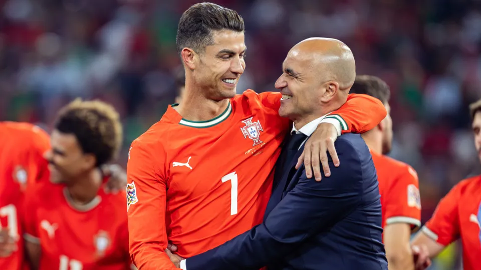 MUNICH, GERMANY - 2025/06/08: (L-R) Cristiano Ronaldo of Portugal and Roberto Martinez, coach of Portugal are seen during the ceremony after the UEFA Nations League 2025 final match between Portugal and Spain at Munich Football Arena. Final score: Portuga