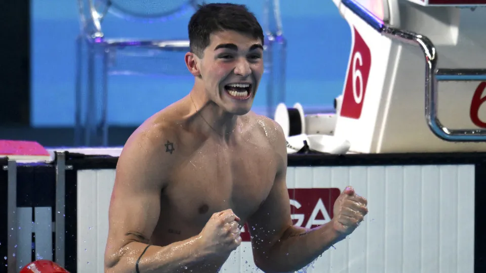 ASPIRE DOME, DOHA, QATAR - 2024/02/12: Diogo Matos Ribeiro of Portugal celebrates after competing in the swimming 50m Butterfly Men Final during the 21st World Aquatics Championships. Diogo Matos Ribeiro placed first winning the gold medal. (Photo by Andr
