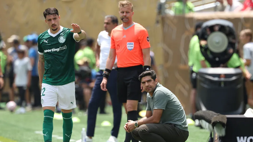 Palmeiras' Portuguese coach Abel Ferreira gestures next to his Uruguayan defender #22 Joaquin Piquerez during the FIFA Club World Cup 2025 round of 16 all-Brazilian football match between Palmeiras and Botafogo at Lincoln Financial Field Stadium in Philad