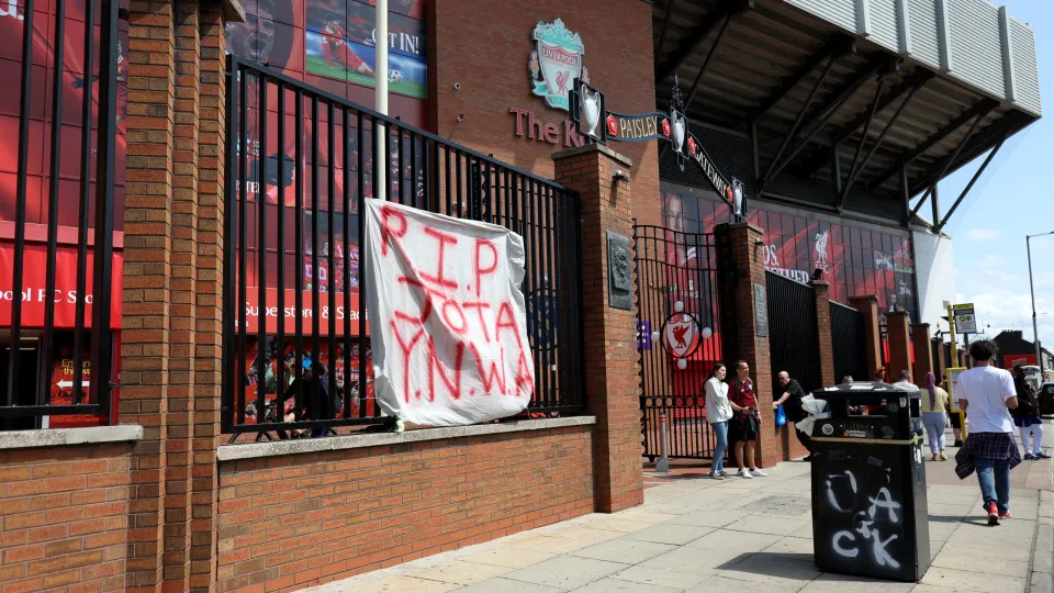 LIVERPOOL, ENGLAND - JULY 03: A general view of the outside of Anfield Stadium as a sheet with a tribute which reads "R.I.P Jota Y.N.W.A" is seen near the Paisley Gateway as tributes are laid for Diogo Jota at Anfield on July 03, 2025 in Liverpool, Englan