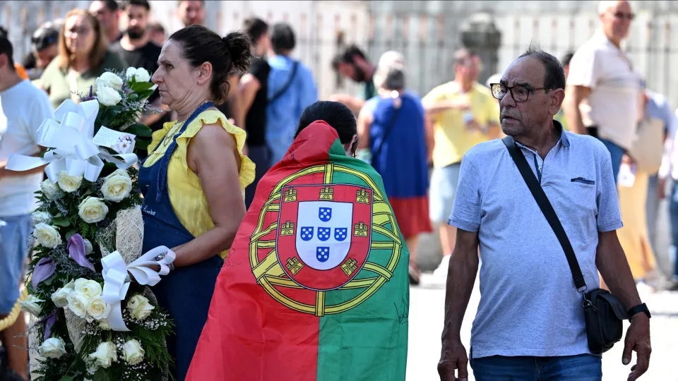 GONDOMAR, PORTUGAL - JULY 04: A young fan of Portugal wears a national flag on the street after a public wake was held for Diogo Jota and his brother Andre Silva at the Capela da Ressurreicao on July 04, 2025 in Gondomar, Portugal. Diogo Jota was a profes