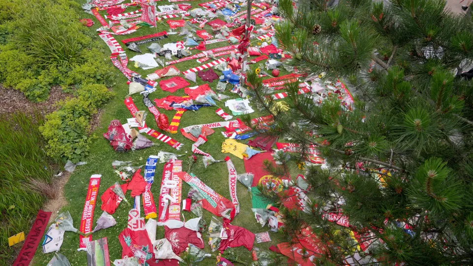 LIVERPOOL, ENGLAND - JULY 04: In this aerial view tributes for Diogo Jota are seen laid on the grass outside Anfield Stadium on July 04, 2025 in Liverpool, England. The current Liverpool player and Portugal international Diogo Jota, 28,  was killed in a c