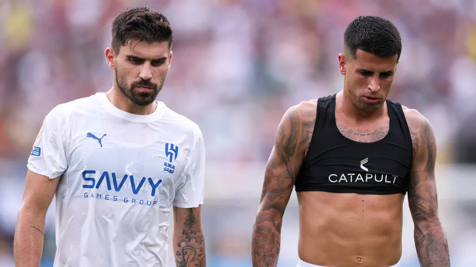 ORLANDO, FLORIDA - JULY 04: Ruben Neves #8 and Joao Cancelo #20 of Al Hilal walk off the pitch at halftime during the FIFA Club World Cup 2025 quarter final match between Fluminense FC and Al Hilal at Camping World Stadium on July 04, 2025 in Orlando, Flo