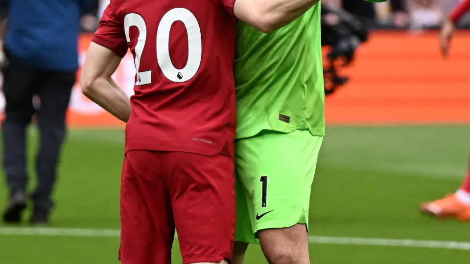 LIVERPOOL, ENGLAND - MAY 06: (THE SUN OUT.THE SUN ON SUNDAY OUT)  Diogo Jota of Liverpool with Alisson Becker of Liverpool before the Premier League match between Liverpool FC and Brentford FC at Anfield on May 06, 2023 in Liverpool, England. (Photo by An