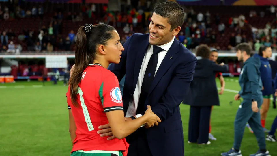 GENEVA, SWITZERLAND - JULY 07: Francisco Neto, Head Coach of Portugal, and Francisca Nazareth of Portugal interact following the team's draw in the UEFA Women's EURO 2025 Group B match between Portugal and Italy at Stade de Geneve on July 07, 2025 in Gene