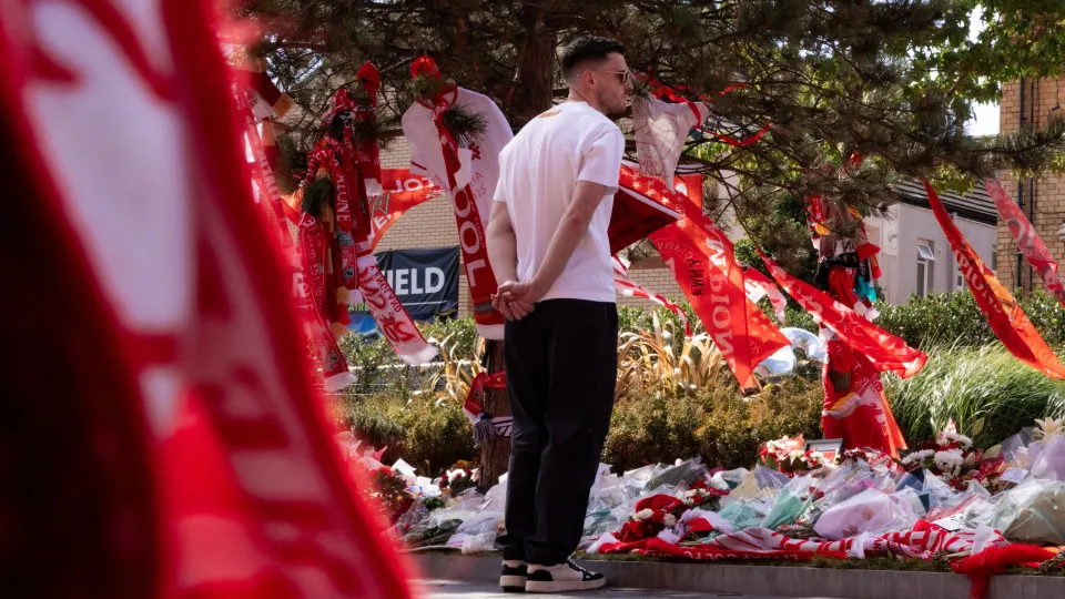 LIVERPOOL, ENGLAND - JULY 08: Andrew Robertson paying tribute to Diogo Jota at Anfield on July 08, 2025 in Liverpool, England. The Liverpool player and Portugal international Diogo Jota, 28,  was killed in a car crash on July 03 in Zamora, Spain. He was t