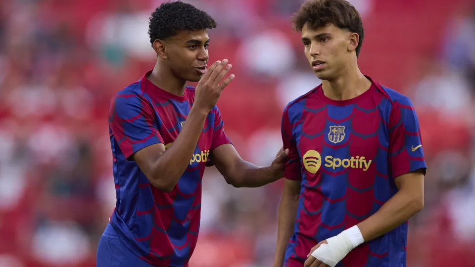 SEVILLE, SPAIN - MAY 26: Lamine Yamal of FC Barcelona interacts with Joao Felix of FC Barcelona during the LaLiga EA Sports match between Sevilla FC and FC Barcelona at Estadio Ramon Sanchez Pizjuan on May 26, 2024 in Seville, Spain. (Photo by Fran Santia