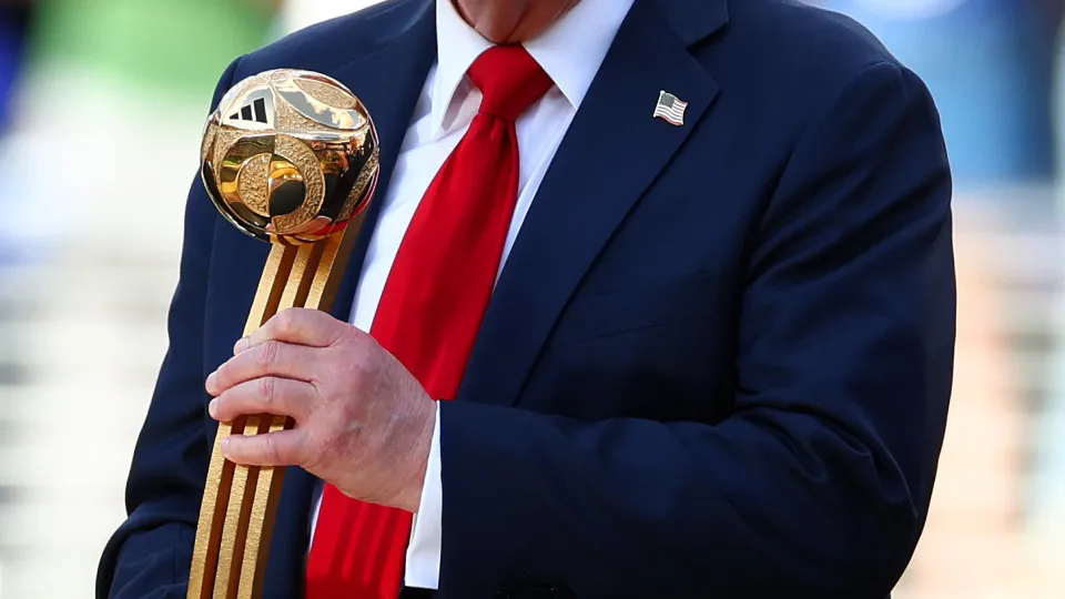 EAST RUTHERFORD, NEW JERSEY - JULY 13: U.S President Donald Trump holds the Golden Ball trophy following the FIFA Club World Cup 2025 final match between Chelsea FC and Paris Saint-Germain at MetLife Stadium on July 13, 2025 in East Rutherford, New Jersey