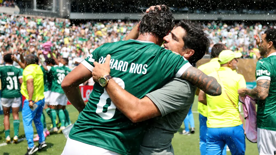 PHILADELPHIA, PENNSYLVANIA - JUNE 28: Abel Ferreira, Head Coach of Palmeiras, embraces Richard Rios #8 after the team's victory during the FIFA Club World Cup 2025 round of 16 match between SE Palmeiras and Botafogo FR at Lincoln Financial Field on June 2