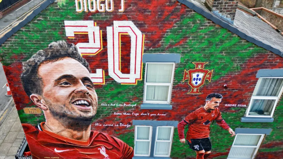LIVERPOOL, UNITED KINGDOM - JULY 21: A mural of the late Portuguese Liverpool footballer Diogo Jota and his brother Andre Silva, creates by street artist Paul Curtis and paints on the facade of a house near Anfield Stadium in Liverpool, United Kingdom on 