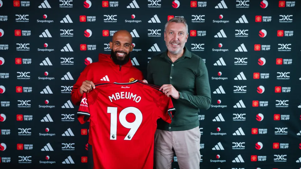 MANCHESTER, ENGLAND - JULY 20: (EXCLUSIVE COVERAGE) Bryan Mbeumo of Manchester United poses with Director of Football Jason Wilcox after signing for the club at Carrington Training Ground on July 21, 2025 in Manchester, England. (Photo by Manchester Unite