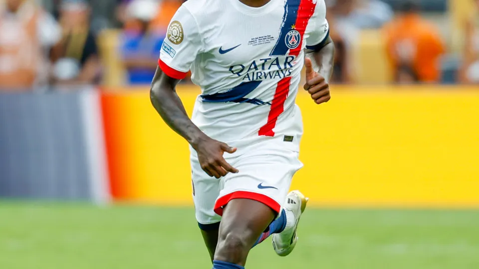 EAST RUTHERFORD, NEW JERSEY - JULY 13: Nuno Mendes #25 of Paris Saint-Germain dribbles the ball during the FIFA Club World Cup 2025 final match between Chelsea FC and Paris Saint-Germain at MetLife Stadium on July 13, 2025 in East Rutherford, New Jersey. 