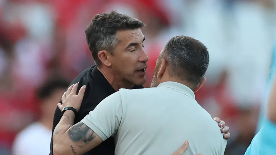 Benfica's Portuguese coach Bruno Lage greets Sporting Lisbon's Portuguese coach Rui Borges at the end of the 'Taca de Portugal' (Portugal's Cup) final football match between SL Benfica and Sporting CP at Jamor stadium in Oeiras, on May 25, 2025. Sporting 