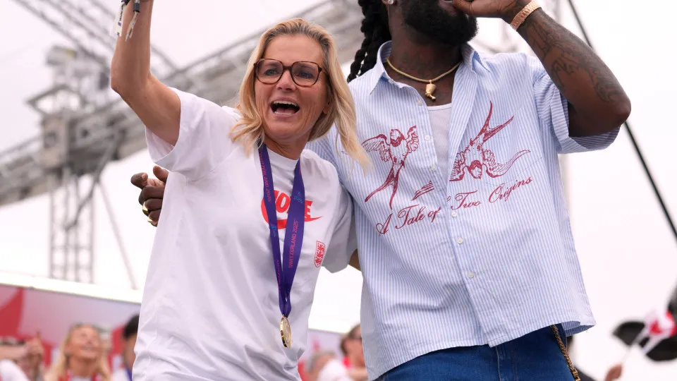 LONDON, ENGLAND - JULY 29: Burna Boy performs on stage alongside Sarina Wiegman, Head Coach of England, during the England Women's team victory parade and celebration on July 29, 2025 in London, England. England defeated Spain in the UEFA Women's EURO 202