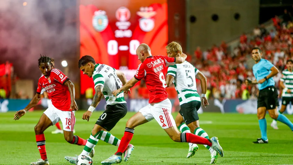 Maximiliano Araujo, forward of Sporting CP, and Fredrik Aursnes, midfielder of SL Benfica, participate in the Portugal Candido de Oliveira Super Cup final football match at the Estadio Algarve in Faro, Portugal, on July 31, 2025. (Photo by Valter Gouveia/