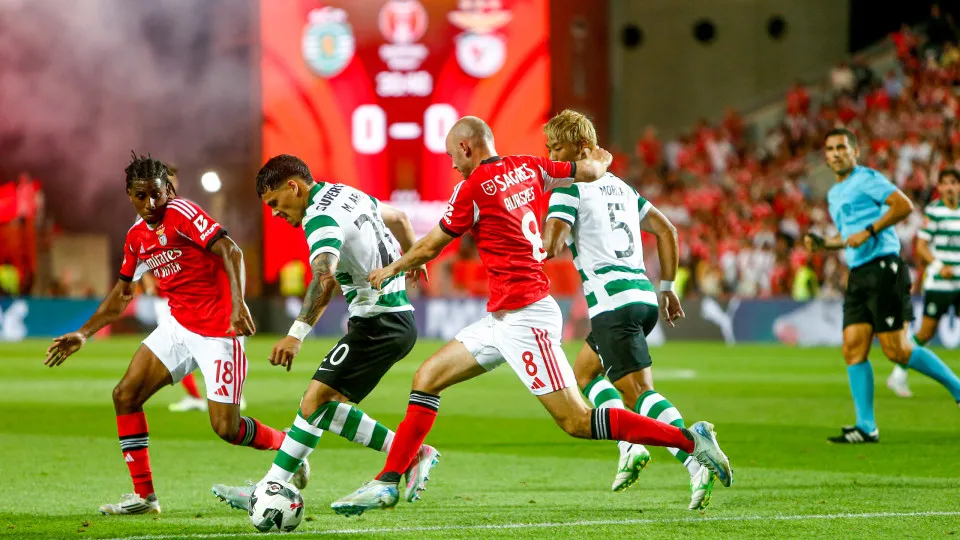 Maximiliano Araujo, forward of Sporting CP, and Fredrik Aursnes, midfielder of SL Benfica, participate in the Portugal Candido de Oliveira Super Cup final football match at the Estadio Algarve in Faro, Portugal, on July 31, 2025. (Photo by Valter Gouveia/