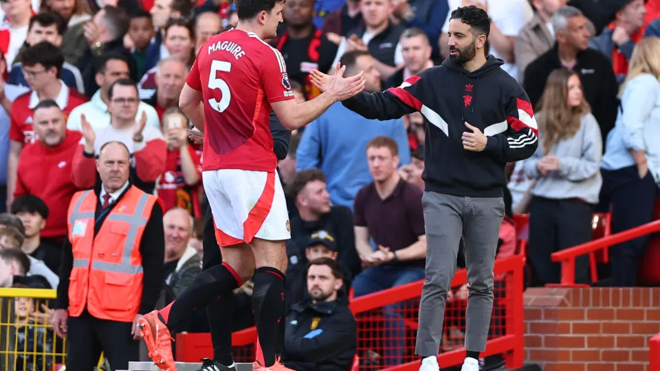 MANCHESTER, ENGLAND - APRIL 6: Manchester United head coach / manager Ruben Amorim embraces Harry Maguire of Manchester United  as he comes off during the Premier League match between Manchester United FC and Manchester City FC at Old Trafford on April 6,