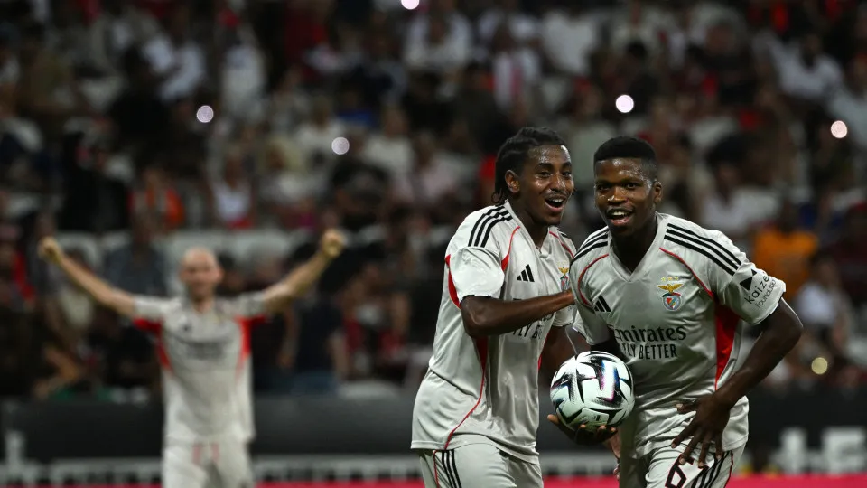 Benfica's Portuguese midfielder #61 Florentino (R) celebrates scoring his team's second goal during the UEFA Champions League 3rd round first leg football match between OGC Nice and SL Benfica at the Allianz Riviera Stadium in Nice, south-eastern, on Augu