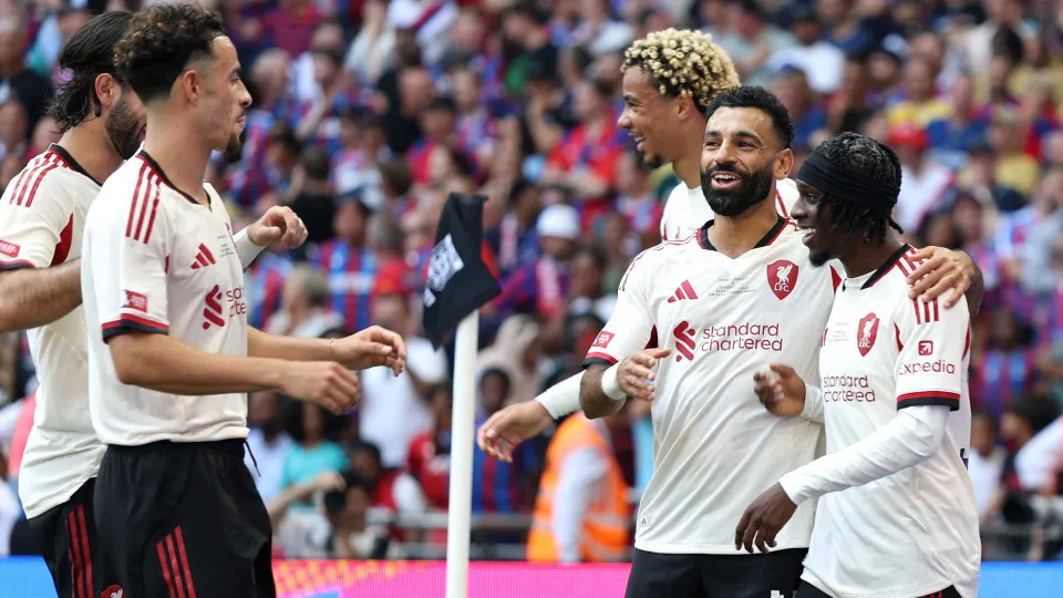 LONDON, ENGLAND - AUGUST 10: Jeremie Frimpong of Liverpool celebrates scoring his team's second goal with teammates Mohamed Salah and Curtis Jones and Dominik Szoboszlai (obscured) during the 2025 FA Community Shield match between Crystal Palace and Liver